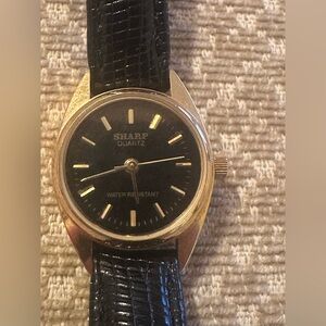 Vintage Sharp Women's Black and Gold Quartz Watch